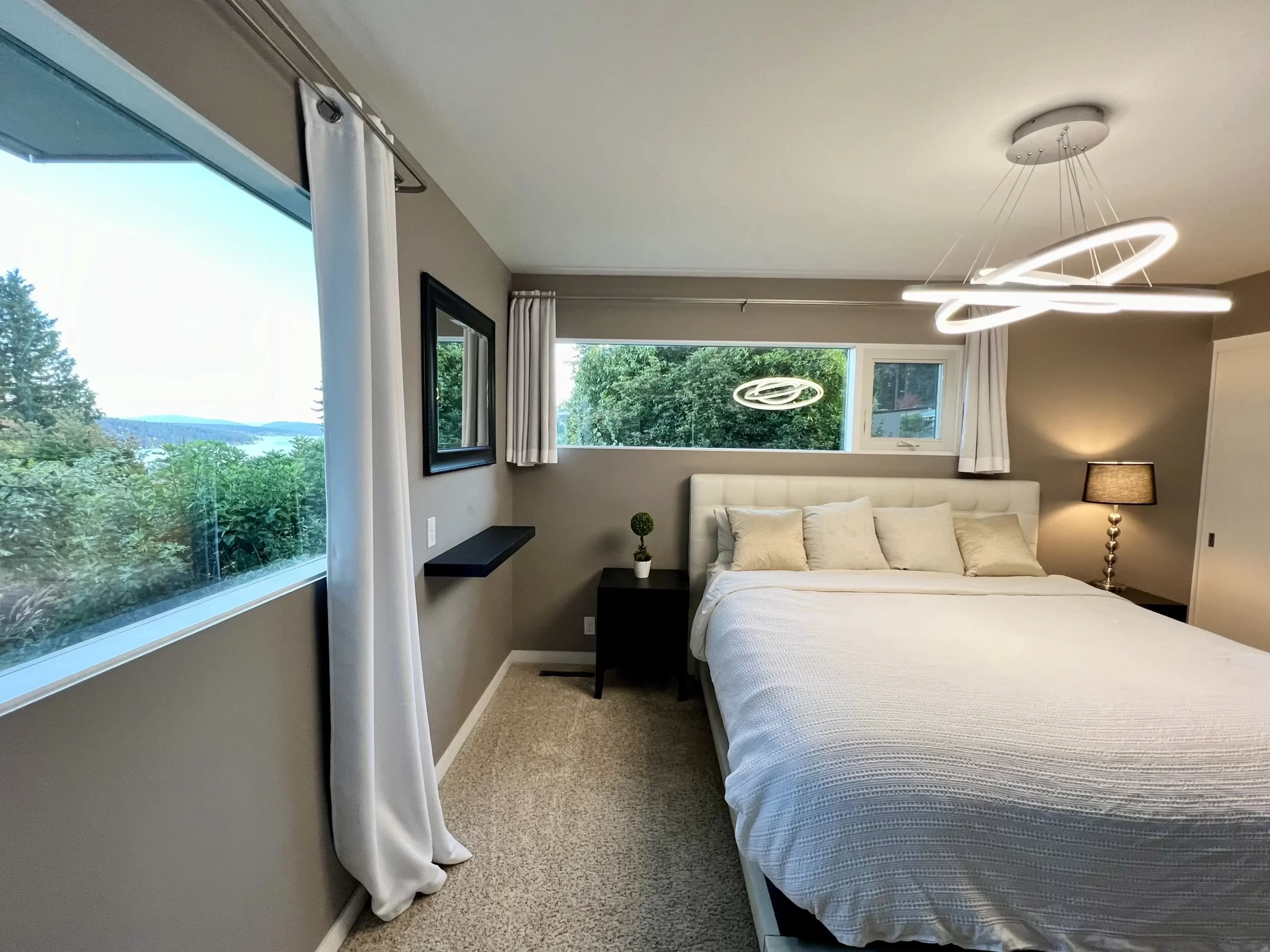 Luxury Suite Lake View at Lake Forest Park – king-size bed with panoramic lake views, furnished short term rental accommodations, travel nurse housing with elegant furnishings