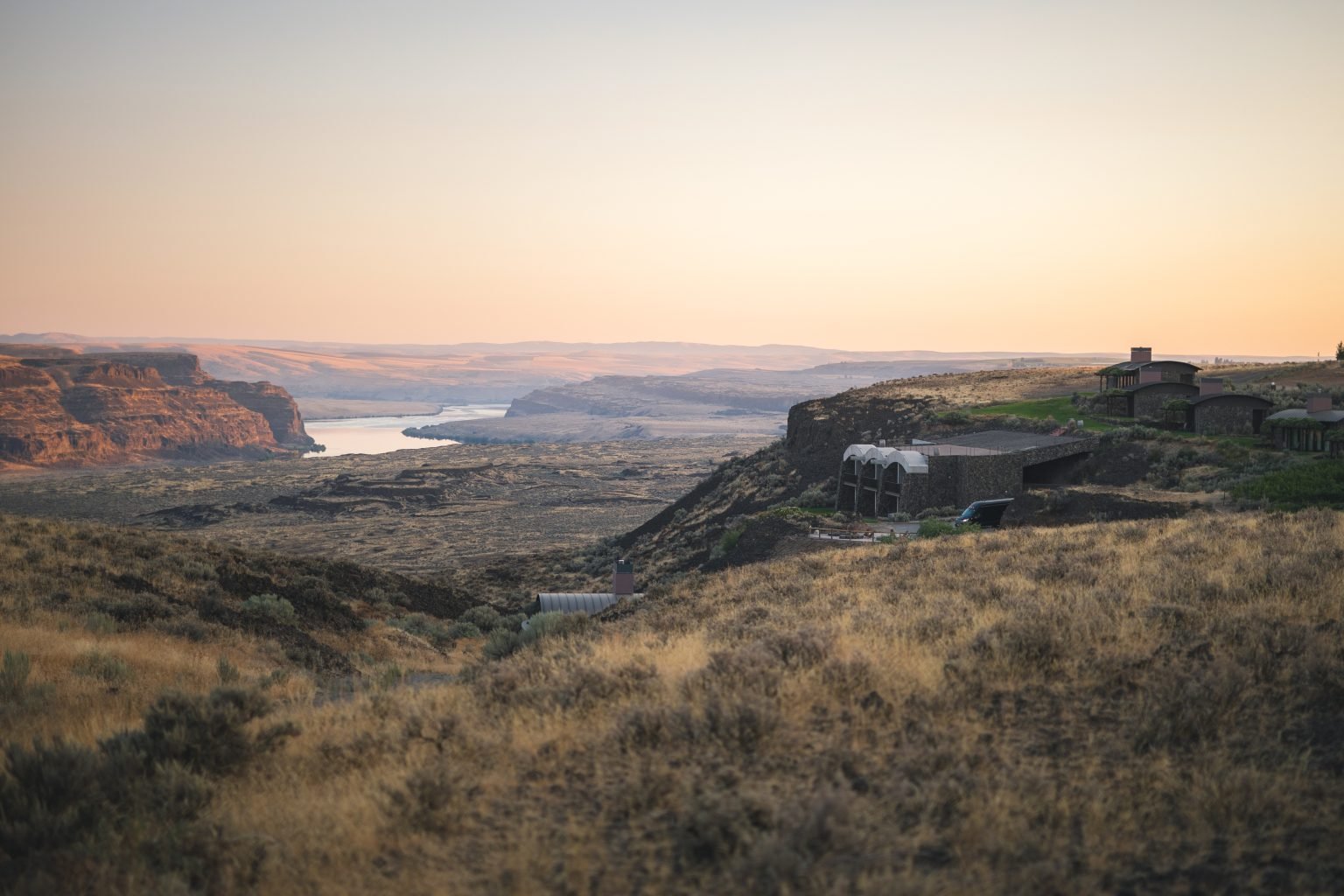 Breathtaking sunset view over the Columbia River Gorge seen from Sagecliffe Residences by Naakef, showcasing the dramatic canyon landscape.